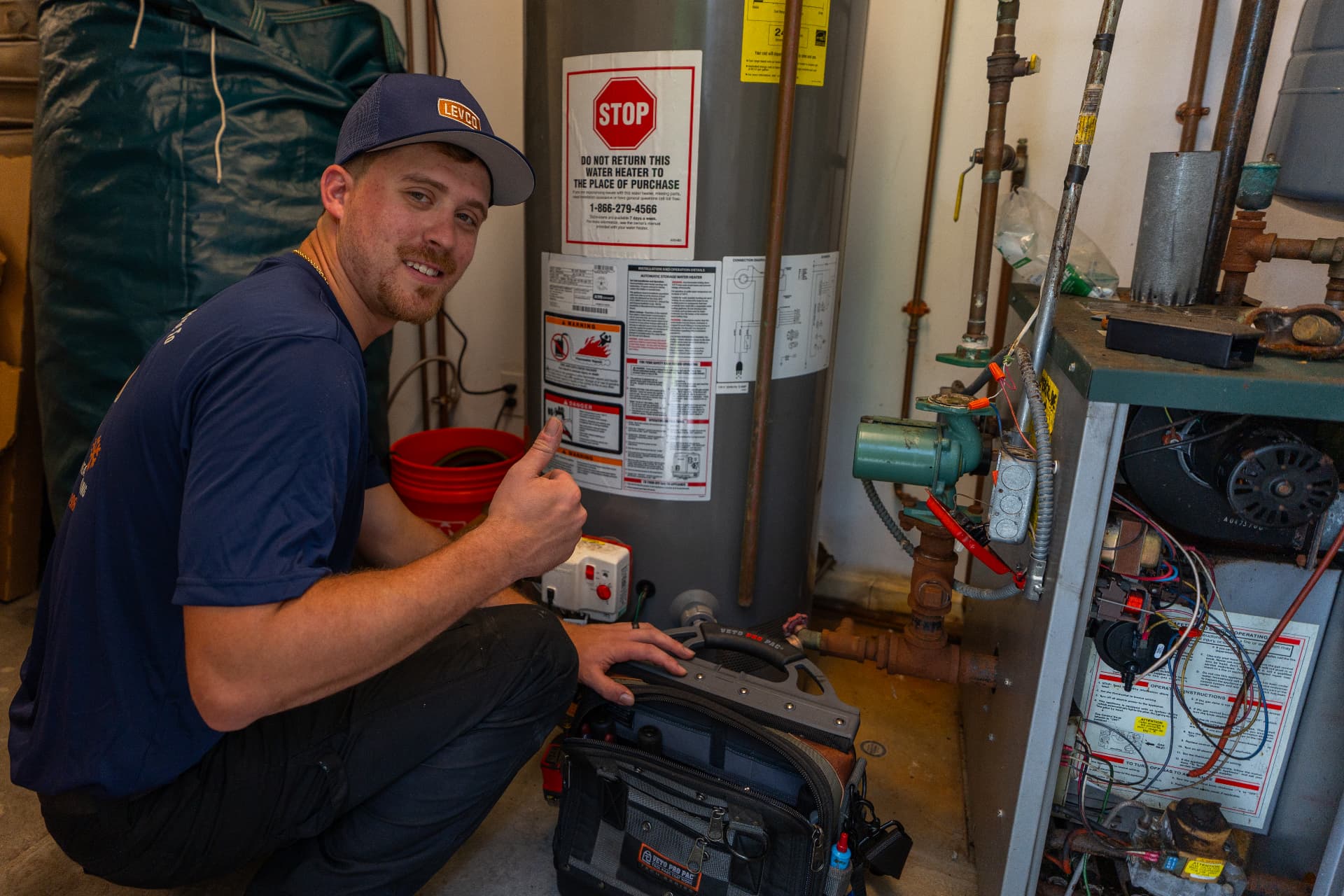 Levco technician working on a home heating system in the field
