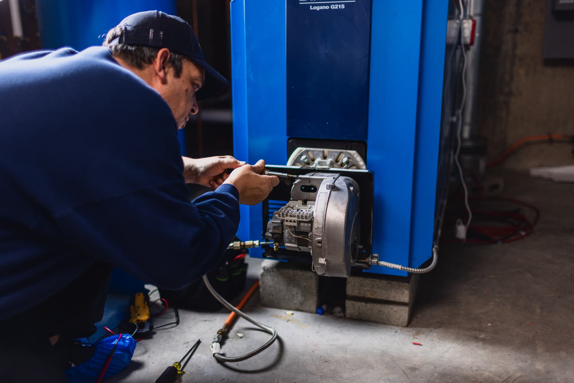 Levco technician carefully setting up the burner on a newly installed boiler