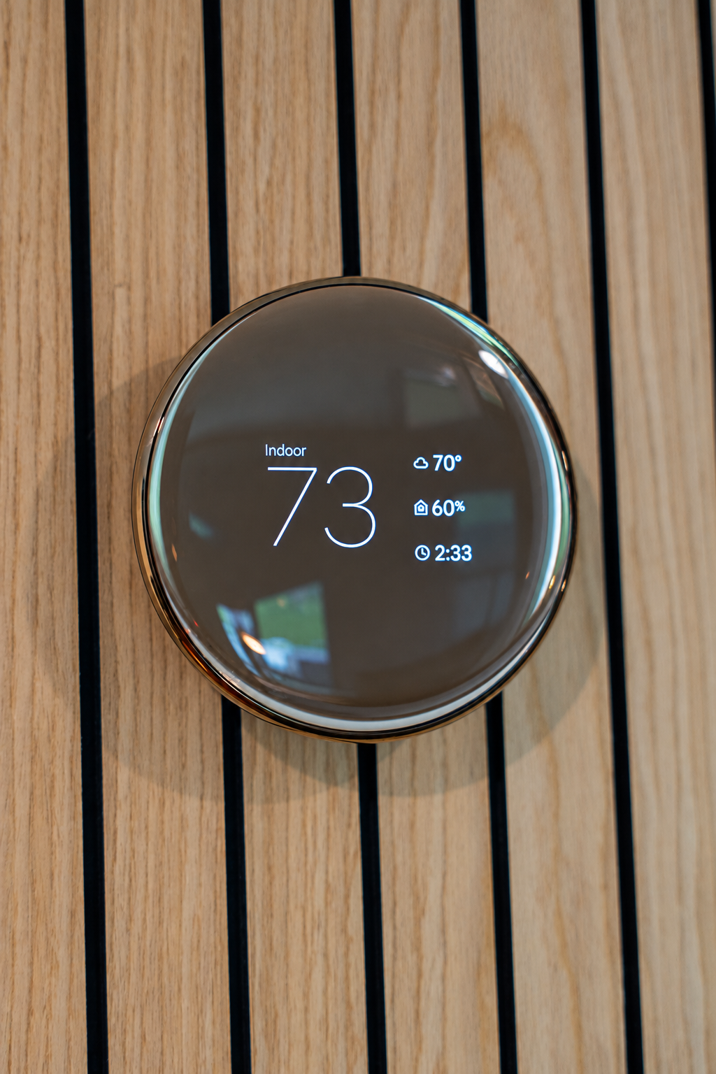 Smart thermostat displaying the indoor temperature in a Connecticut home