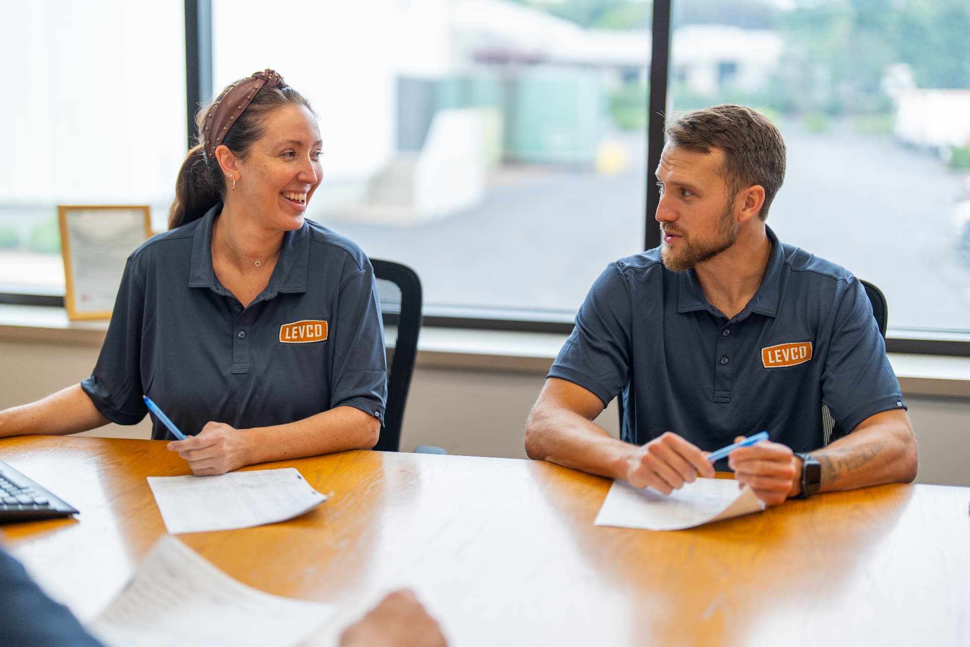 Levco team members reviewing project details together at the office