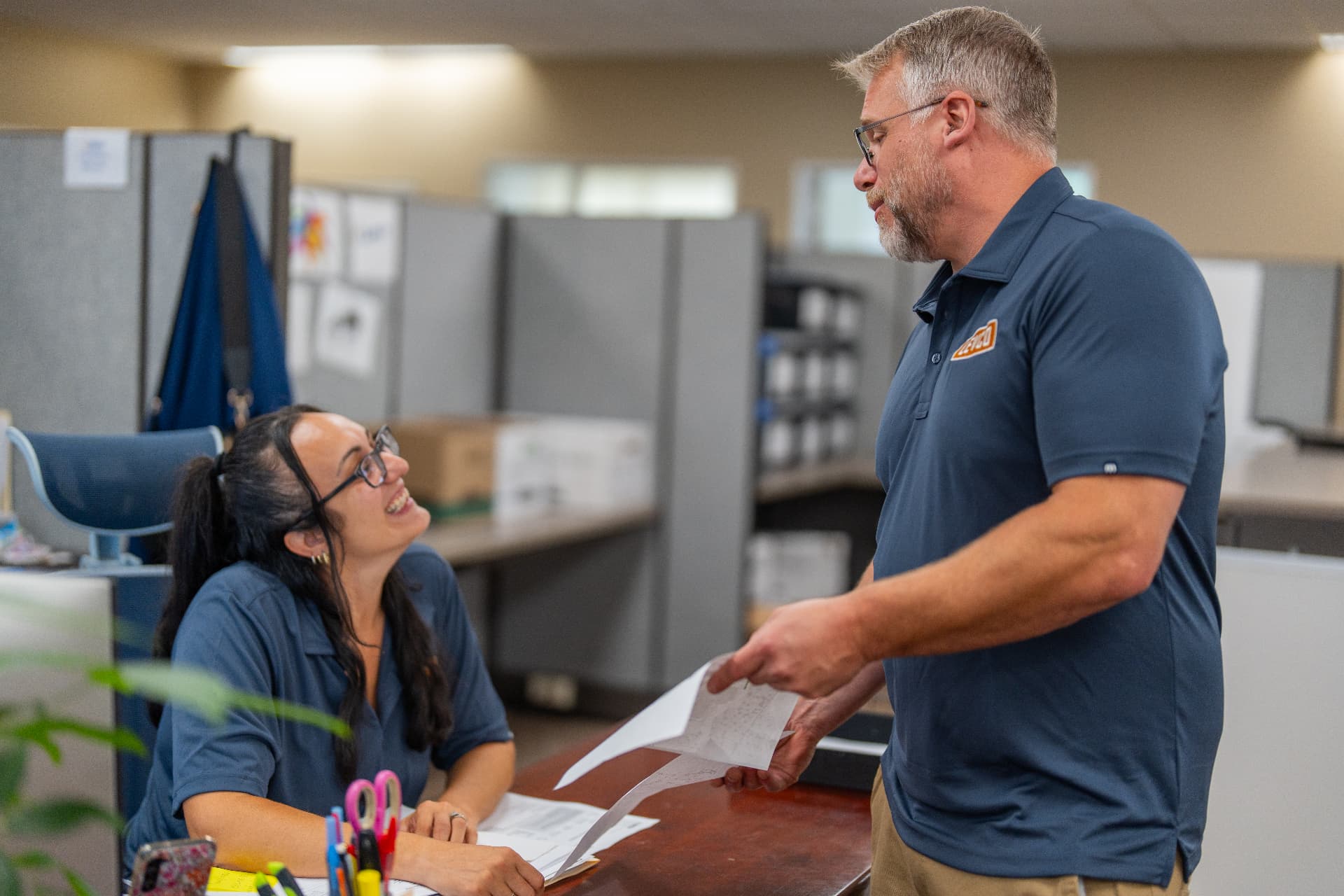 Levco team members reviewing installation paperwork at the Trumbull office