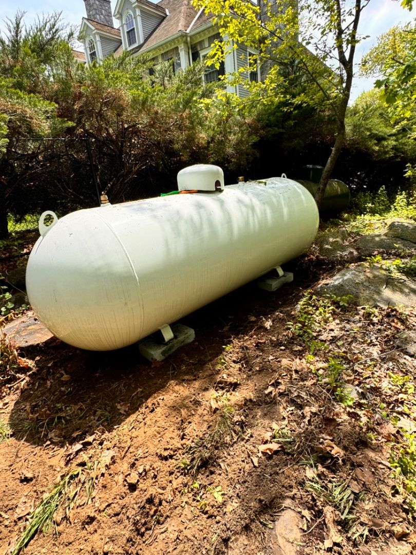 Residential propane tank installed beside a Connecticut home