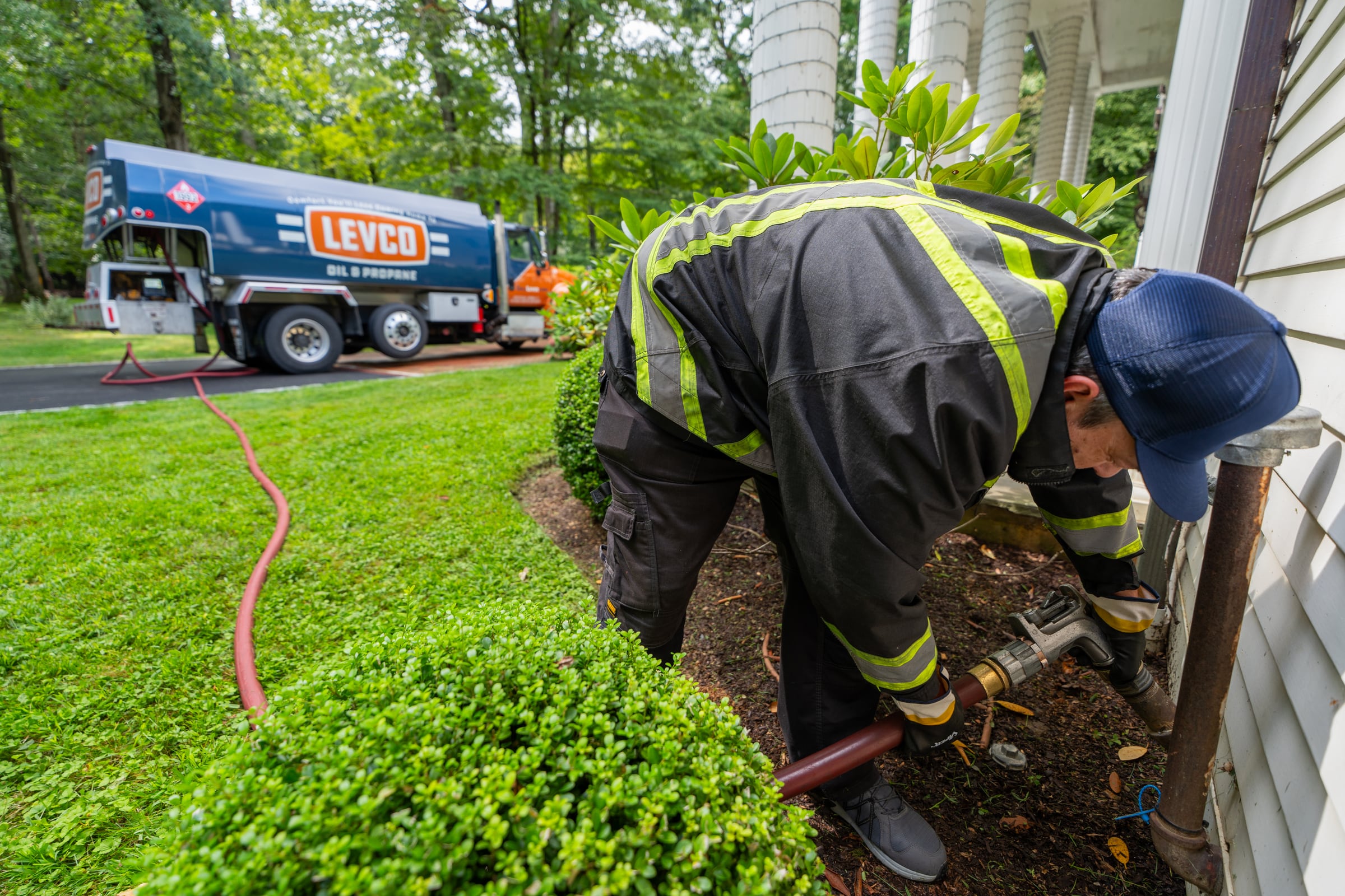 Levco driver connecting an automatic heating oil delivery at a Connecticut home